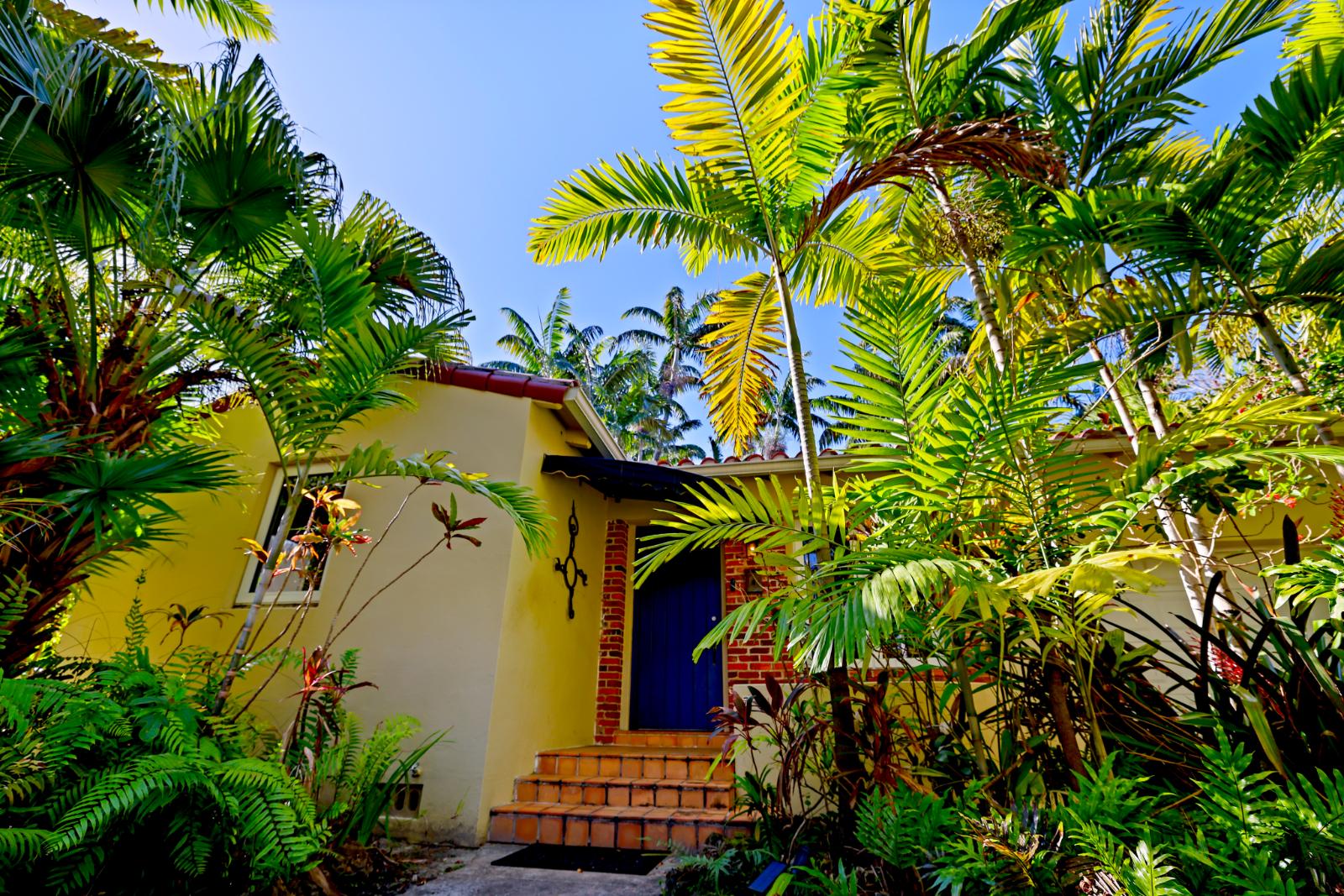 Side exterior angle with tropical planting and architectural detail