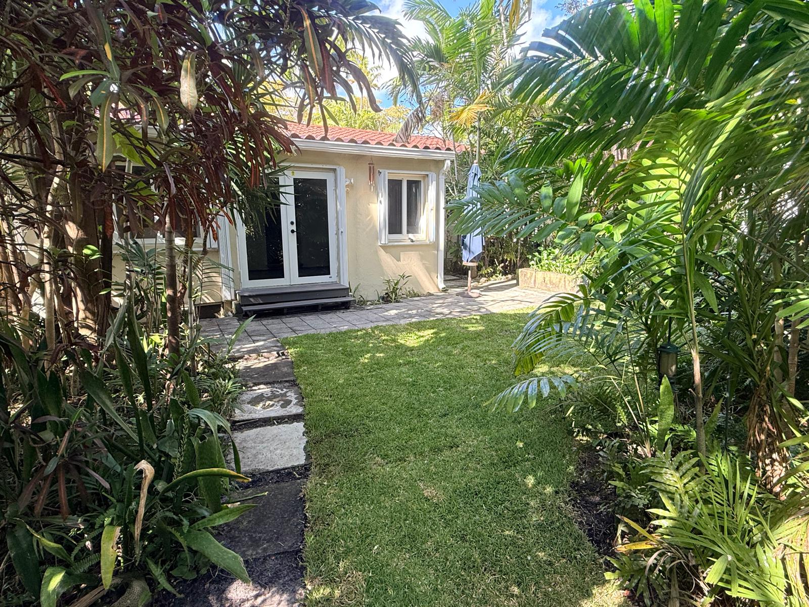 Backyard garden with dense tropical landscaping